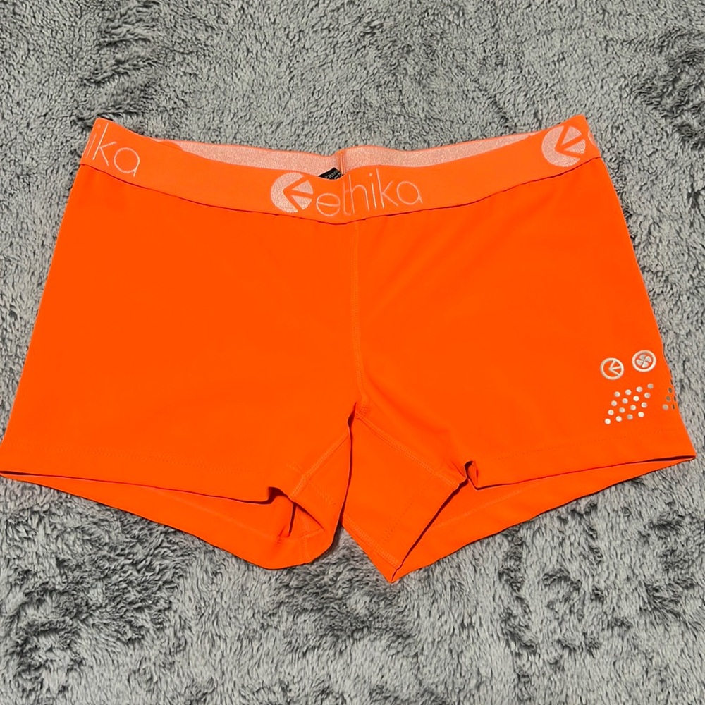 Orange workout shorts.